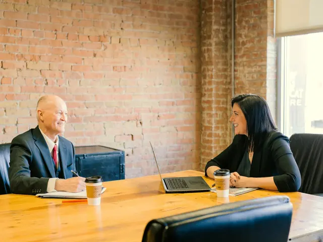 Attorney meeting a client across a conference table